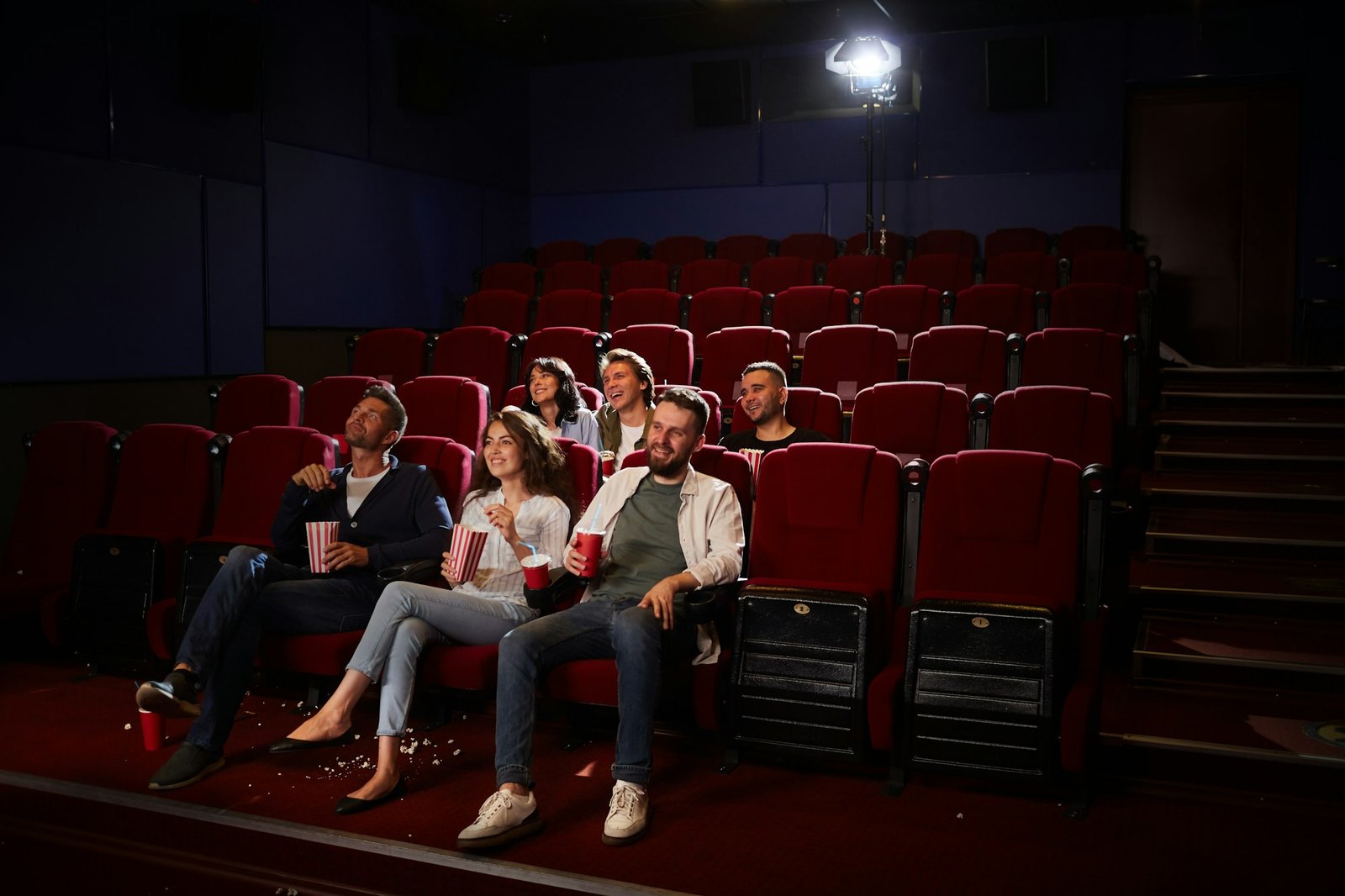 Young People Enjoying Private Viewing in Cinema